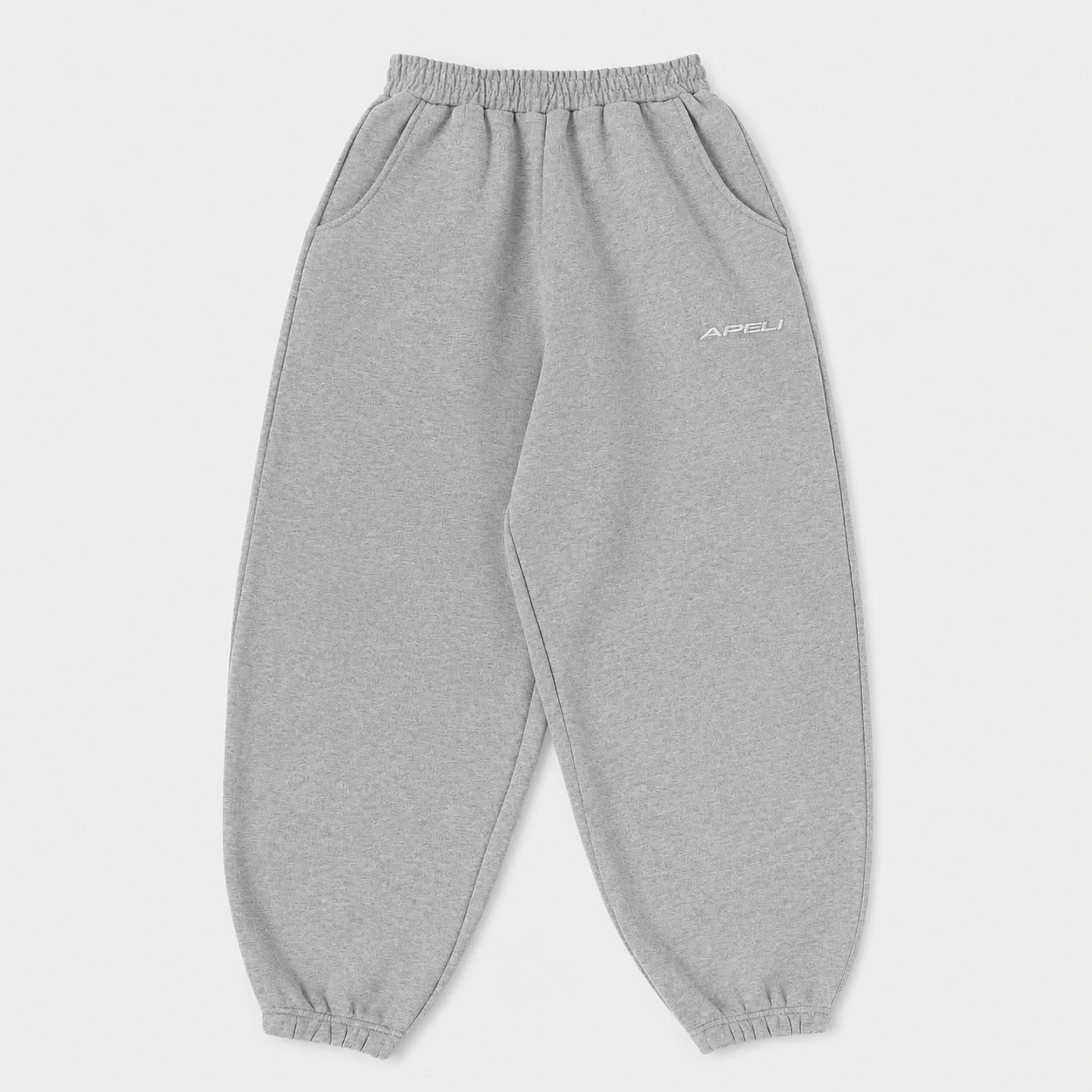 Gray sweatpants with a brand logo on a light gray background